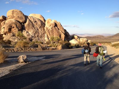 Monica and John, walking back to camp to start to...