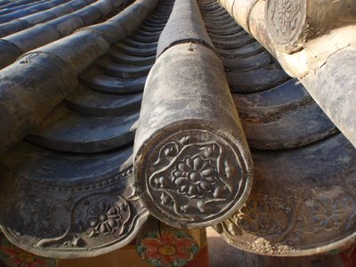 Detail of the clay tiles that cover the wooden roof.