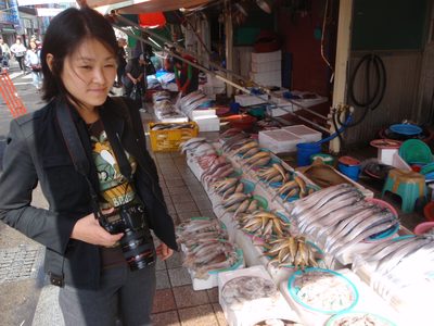 Inspecting the wares at the Jagalchi Fish Market in Busan.