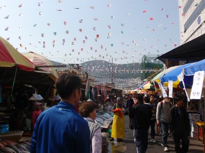 Lines of vendors selling everything from wriggling sea...