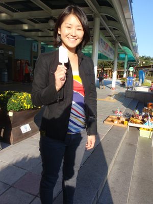 Monica eating one of the red bean popsicles her dad bought us.