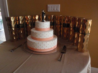 Wedding cake, with Moet et Chandon, and two spies or something.
