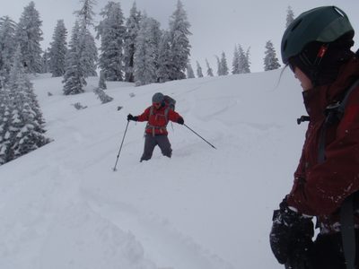 Vinnie snowboarding with poles.