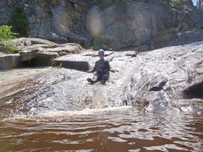 Monica on a water slide in Ten Mile Creek.