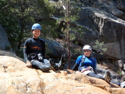 Monica and Catherine sun out on a rock by the side of...