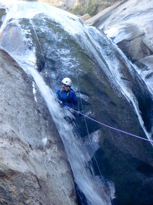 Catherine rappelling, almost Australian style.