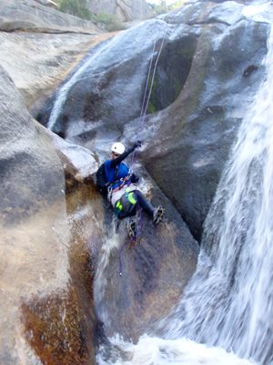 Catherine on the 4th and final rappel, sliding again.