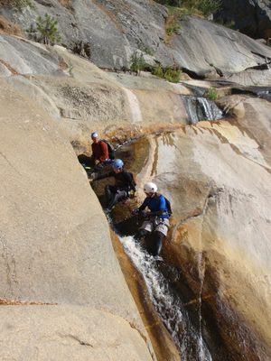 Catherine tests out a rather steep water slide while...