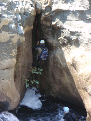Andy on a short rappel into a washing-machine like pool.