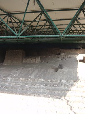 The black thing is an actual stone used for human sacrifice.