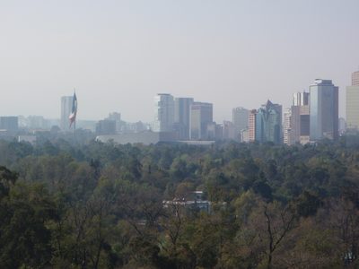 Mexico City skyline looking north: smog, skyscrapers,...