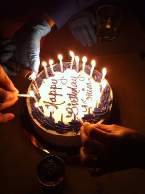 Lighting the last. The blue gloved hands are mine, as I...