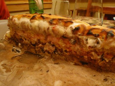 Oreo peppermint bark Baked Alaska showing its layers -...