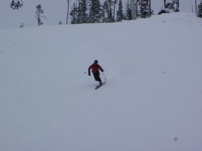 John skiing down under the quad at Big Sky.