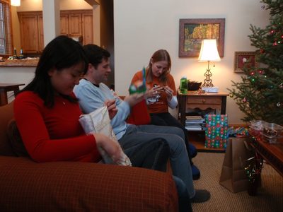 Monica, Jay and Catherine opening presents on Christmas morning. 