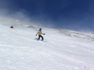 Monica riding down from the top of Lone Mountain.