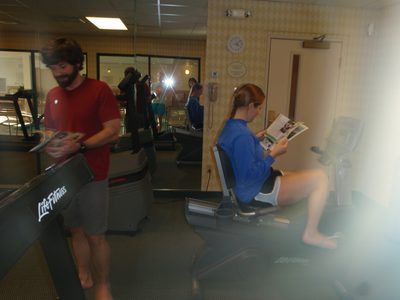 Jay and Catherine use the gym at the seaside resort we...