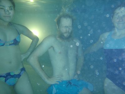 Monica, John, and Catherine underwater.