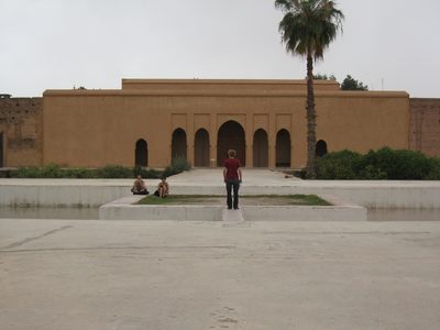 Trevor walking across a pool in the El Badi Palace.