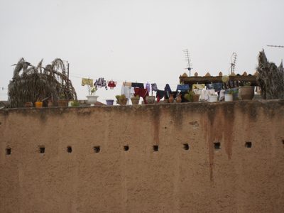 A clothesline and some pots near the medina and El Badi...