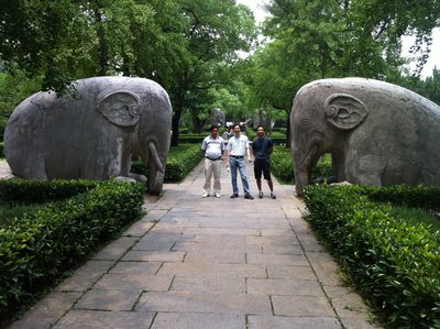 Our guide, Yang, and Paul with a pair of stone elephants.