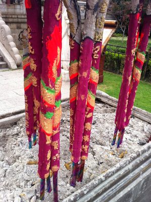 Incense sticks in front of the temple.