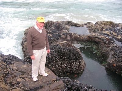 Dad at Devil's Churn tidepools with green anemone and...