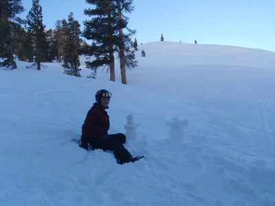 Monica built a small snowman.