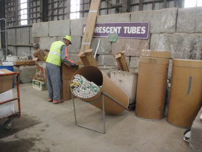 Here, fluorescent lighting tubes are sorted. ...