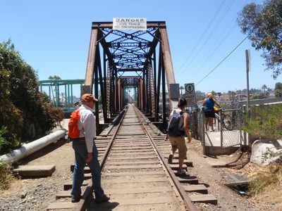Dad and Monica use the railroad tracks as a convenient...