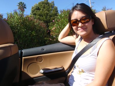 Monica hanging out in the BMW during Mom's tour of UC...