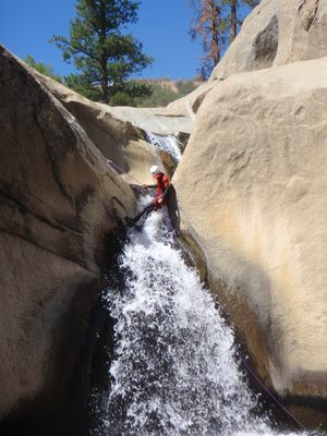 John, lowering himself into the falls.