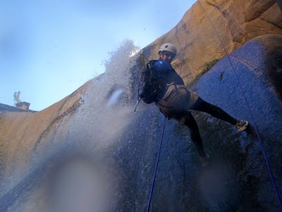 Catherine rappelling into the swirling whirlpool of death.