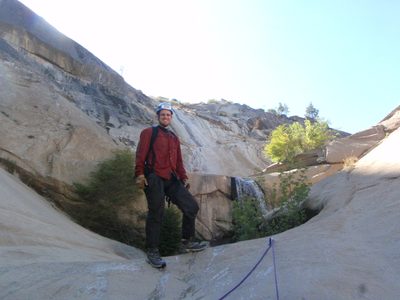 Joel at the top of the fourth rappel.