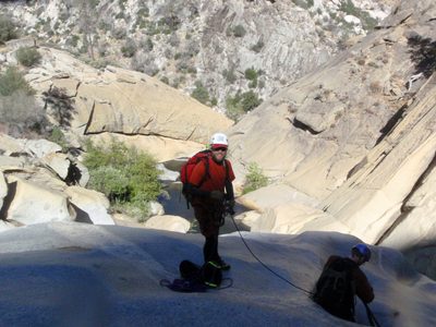 John at the top of the 5th rappel.  Monica gets ready to rappel.