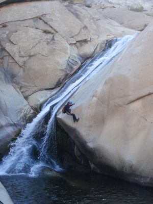 Monica, nearing the end of the 5th rappel which briefly...