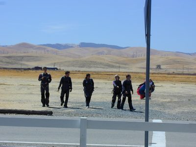 Walking back across the field after landing.