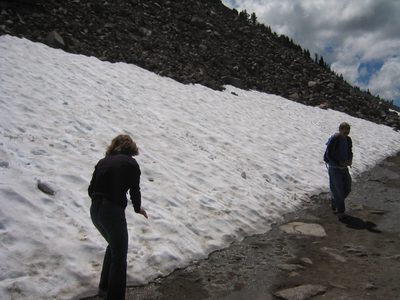 Alison and John playing on a snow field near Crater Lake.