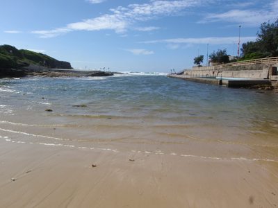 Clovelly Bay with a sea-pool at the right.