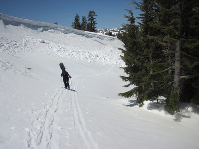 Monica hiking below a broken cornice.