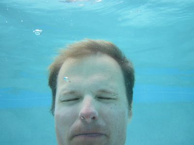 Swimming in the lagoon pool. Turns out it's hard to hold...