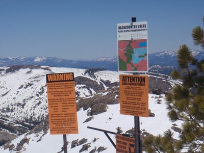 Signs at the border of Sugar Bowl ski area. Donner Lake...