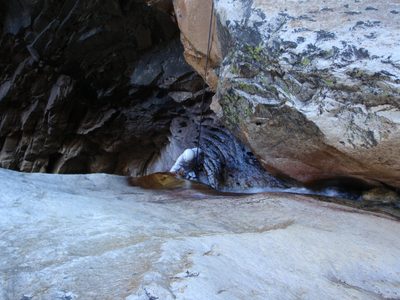 John rappelling through the waterfall.