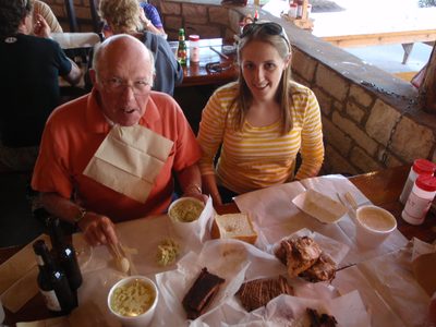Dad and Catherine, sitting before almost $50 of barbecue...