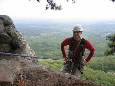 John about to rappel from the top of Belly Roll (5.3).