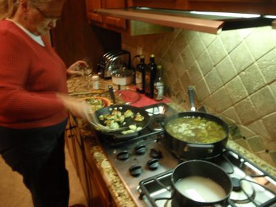 Mom cooking some sort of vegetarian dumpling soup. It...
