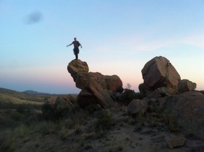 Playing on a rather funny shaped rock.