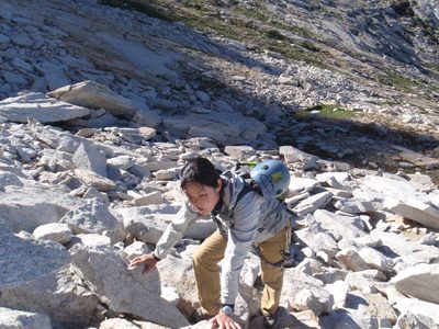 Climbing up the talus at the base of the climb.