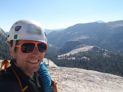 John at the top of Holdless Horror, with his helmet at a...