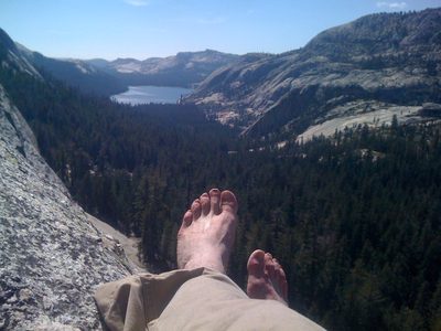 Alex airing his aching feet at the top of pitch 2.